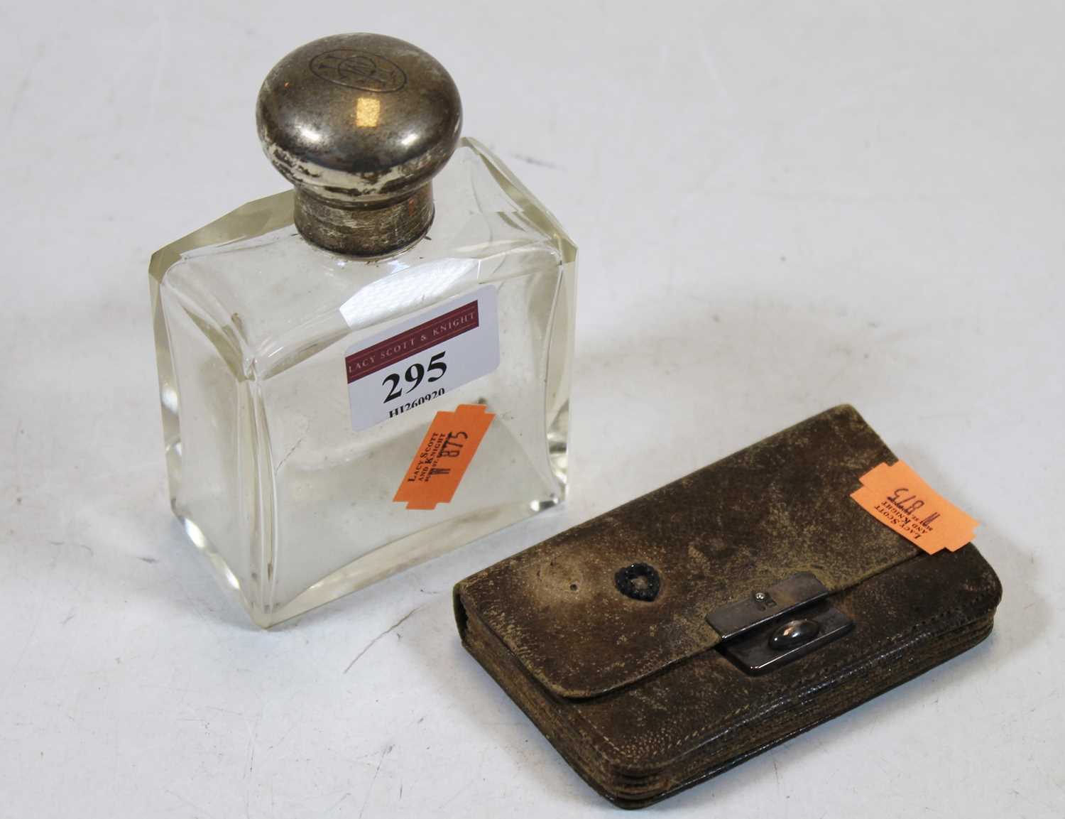 A late Victorian scent bottle, having a square glass body with silver cap; together with a circa