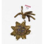 An early 20th century Masonic 'tinsel' type embroidered badge, length 18cm