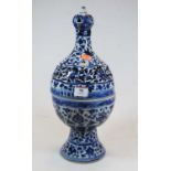 A Chinese export blue & white earthenware incense burner, the onion top over a globular body