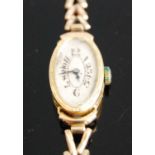 A Vintage ladies 9ct gold cased dress watch having unsigned oval dial, manual wind movement and on