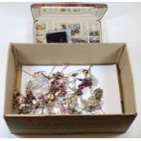 A box of miscellaneous mainly modern costume jewellery to include various loose earrings, gold