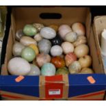 A box of mixed polished hard stone eggs