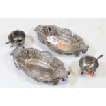 A pair of Edwardian silver bonbon dishes, each of pierced and shaped oval form having floral