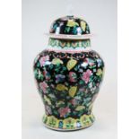 A Chinese export famille noir jar and cover of baluster form, decorated with flowers, six