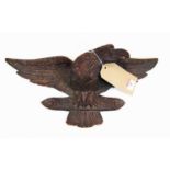 A 19th century carved oak model of an eagle, with glass eye, width 46cm