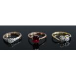A ladies 9ct gold garnet set ring together with a 9ct gold and platinum diamond solitaire ring,