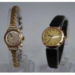 A ladies 9ct gold cased manual wind wristwatch, case dia. 22mm, together with one other (2)
