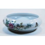 A Chinese export bowl of squat form, decorated with flowers and butterflies, six character mark to