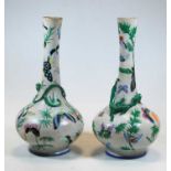 A pair of eastern earthenware vases, each enamel decorated with butterflies, height 33cmCondition