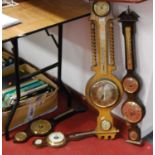 A reproduction mahogany wall barometer together with three others similar