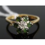 A modern 18ct gold emerald and diamond flowerhead cluster ring, 3.6g, size Q