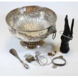 A silver plated punch bowl having a repoussee decoration and lion mask handles, together with a ring