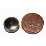 A 19th century pressed horn snuffbox, of cylindrical form, the removable cover relief decorated with