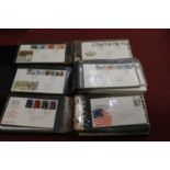 A large collection of assorted Royal Mail first day covers, contained in seven albums, mainly dating