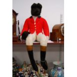A 20th century stuffed fox huntsman, possibly Casa Roma, Lincolnshire, in red jacket and breeches,