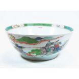 A 19th century Chinese export punch bowl, decorated with battling figures on horseback, 39cm