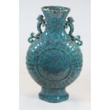 A Chinese export turquoise glazed moon vase, the neck flanked by lizard handles, seal mark to the