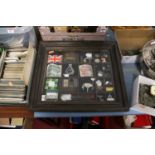A table top display case and contents to include Bank of England £1 and 10 shilling bank notes,