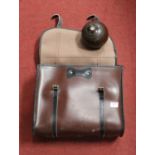 Four lignum vitae lawn bowls, in faux leather satchel