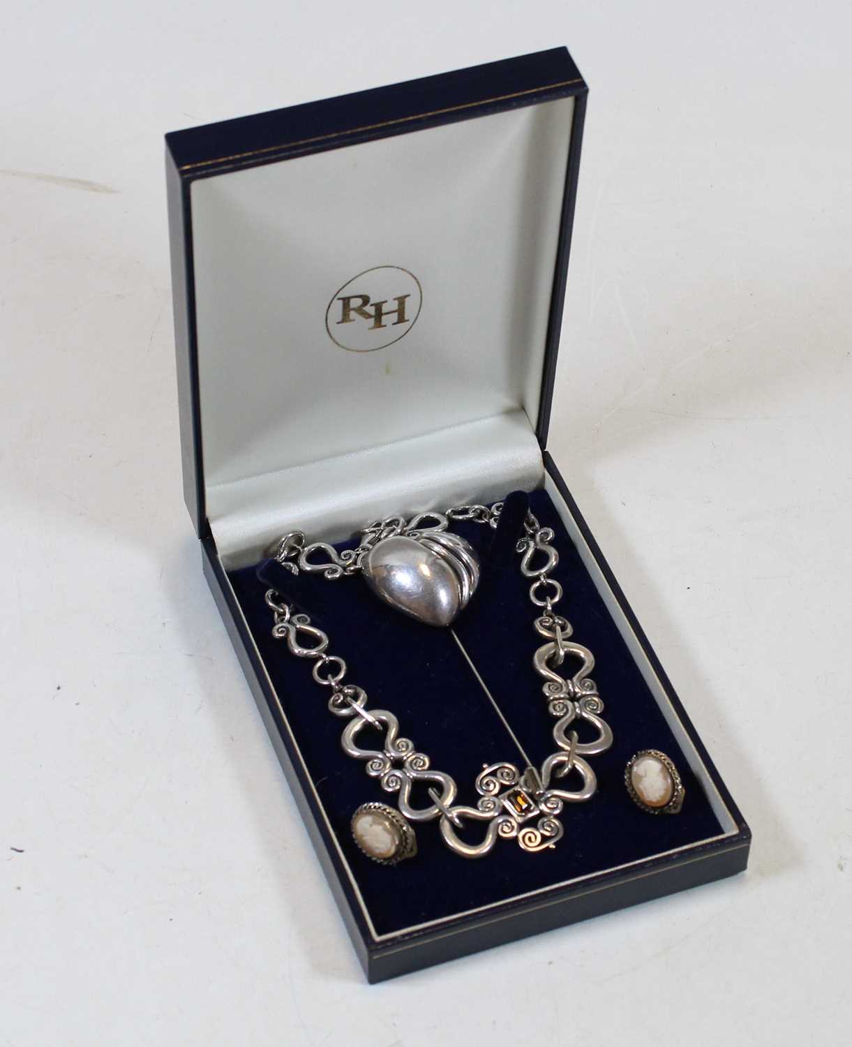 A mid-20th century lady's silver necklet, in the Celtic style, having inset baguette cut gemstone,