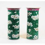 A pair of Chinese export stoneware vases of cylindrical form with flared rim, decorated with