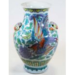 A Chinese export vase of baluster form with applied butterfly handles, decorated with flora and
