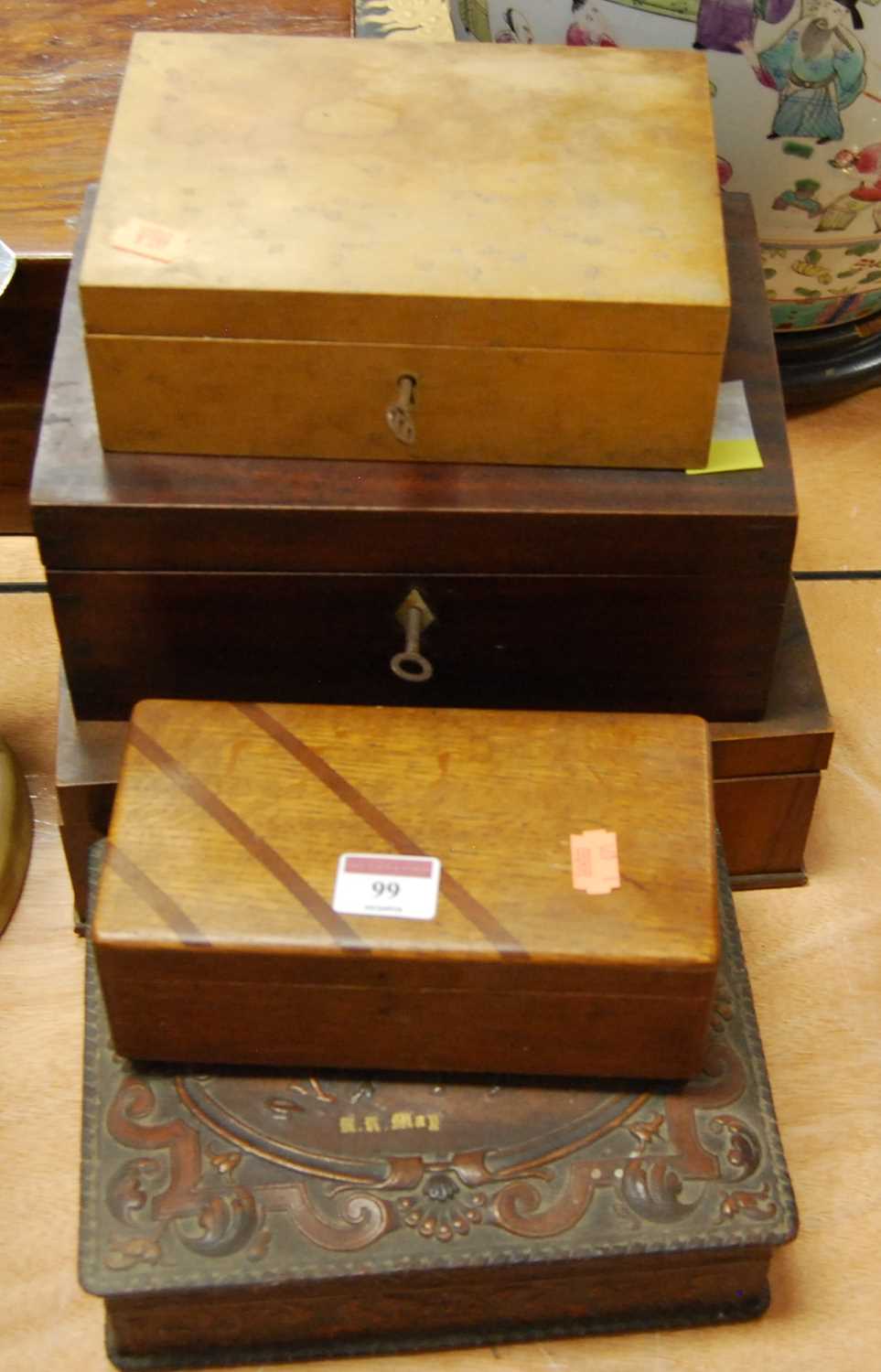A 20th century birds eye maple box together with a 19th century mahogany box, a 1930s oak box, a