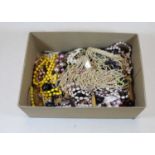 A box of miscellaneous costume jewellery, to include various mainly beaded necklaces