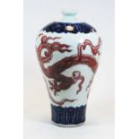 A Chinese export earthenware Meiping vase, decorated in red and blue with a dragon, height 29cm