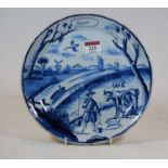 An 18th century blue and white Dutch Delft calendar plate for April, dia.23.5cm