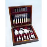 John Nowill & Sons of Sheffield - a six-place setting cutlery suite, in fitted burr walnut