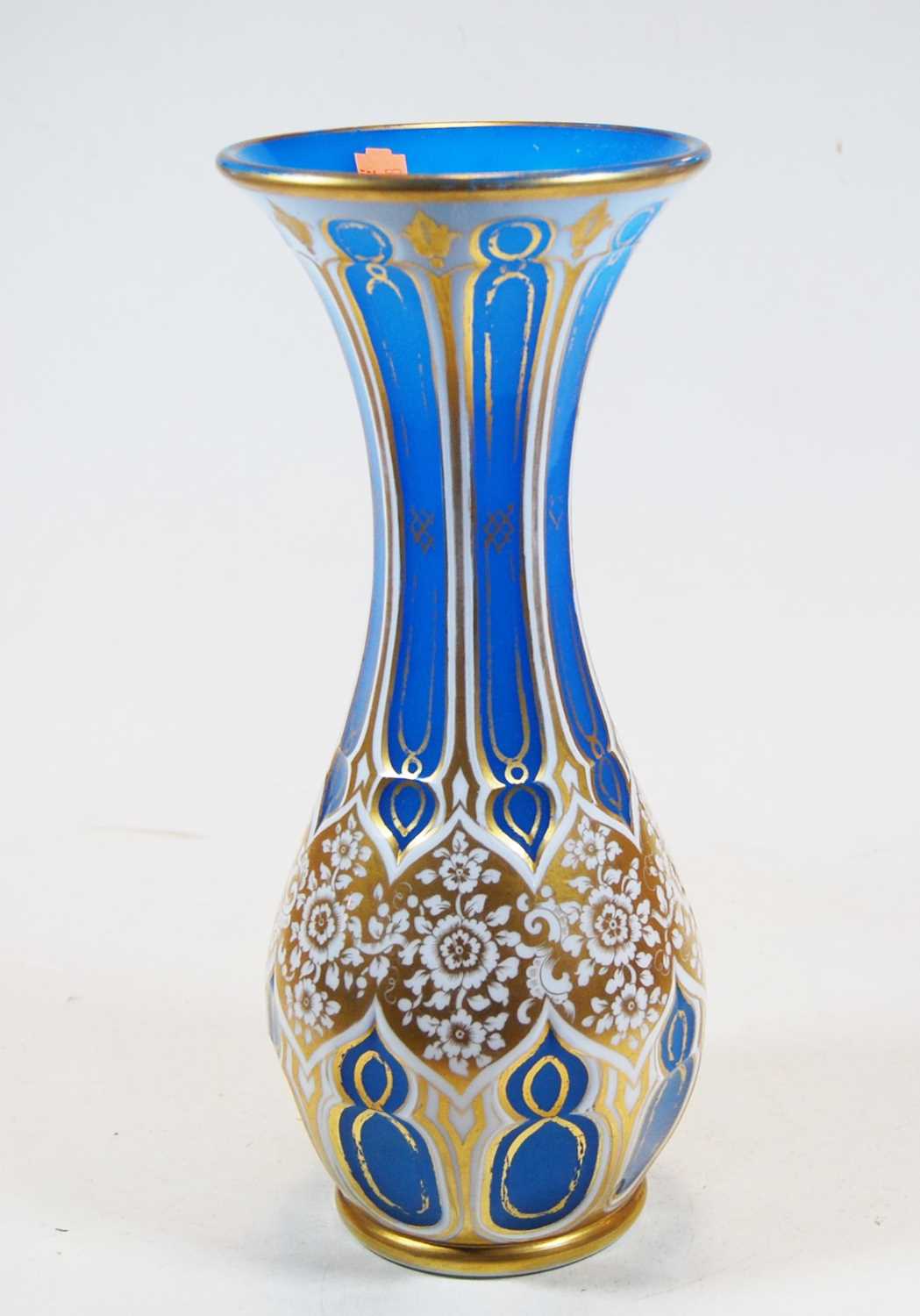 A late 19th century Bohemian blue overlaid vase with gilded decoration, height 30cmCondition report: