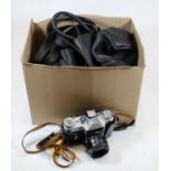 A box of miscellaneous cameras and accessories, to include a Zenith E camera with Helios 442 lens,