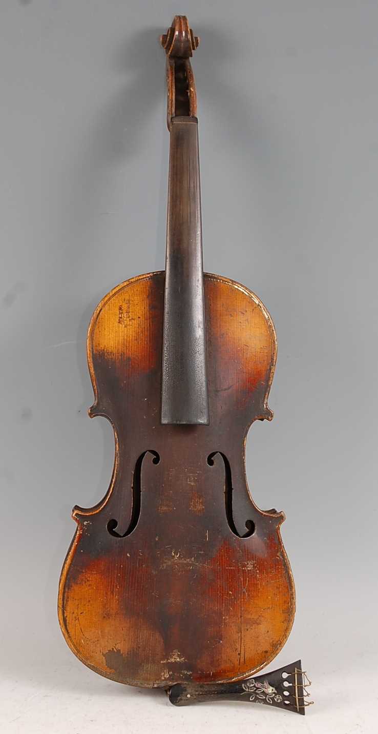 An Italian violin, having a two piece maple back with ebony fingerboard and mother of pearl inlaid