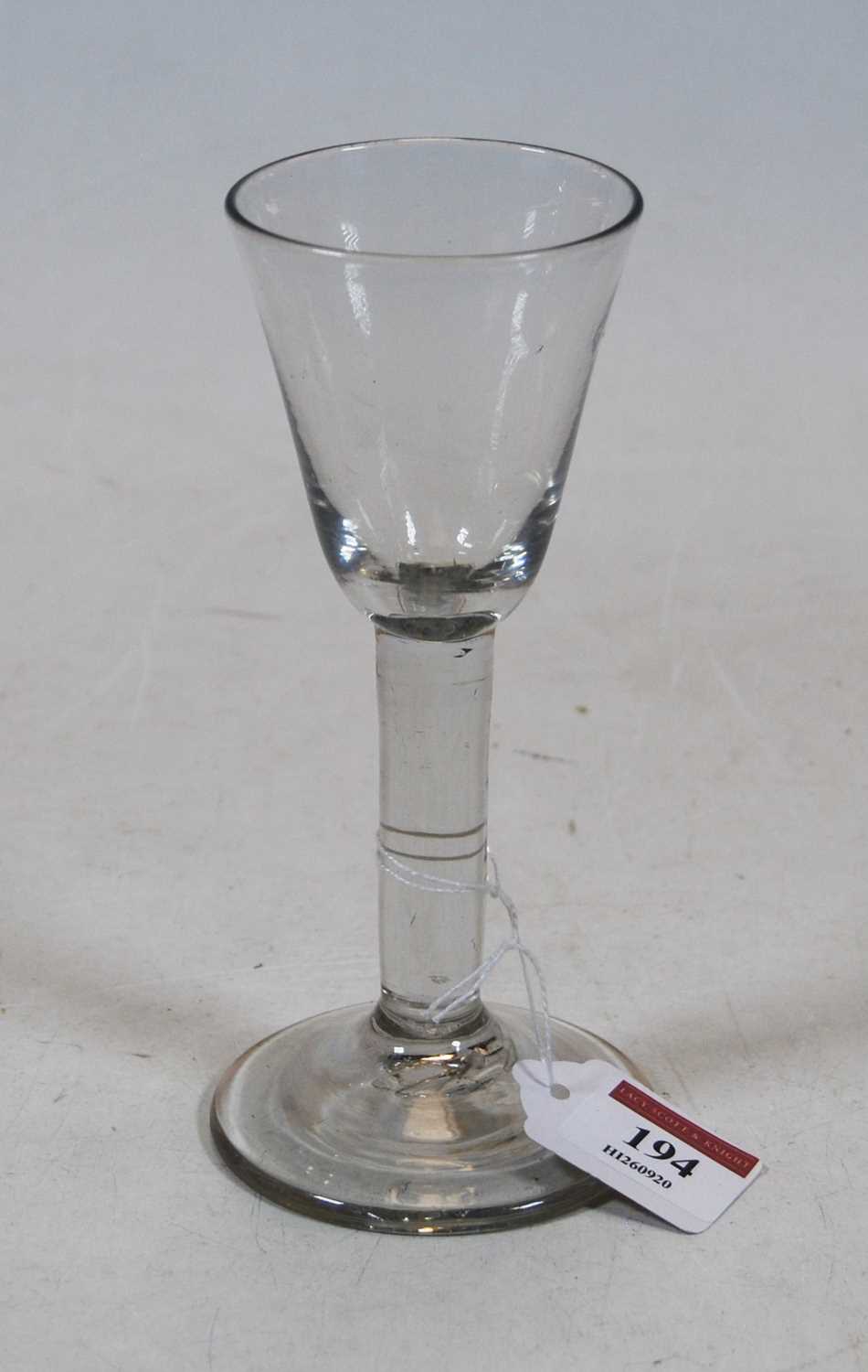 A 19th century wine glass having funnel bowl and conical foot, 17cm