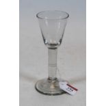 A 19th century wine glass having funnel bowl and conical foot, 17cm