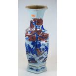 A Chinese export vase, of hexagonal baluster form, decorated with figures before a mountain