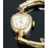 A ladies Ingersoll gold plated mechanical wrist watch