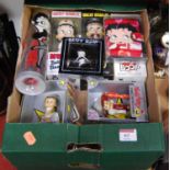 A box containing a collection of Betty Boop memorabilia to include bobble head figures, wallet, etc