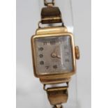 An Art Deco ladies 18ct gold cased tank watch having silvered dial, manual wind movement, case width