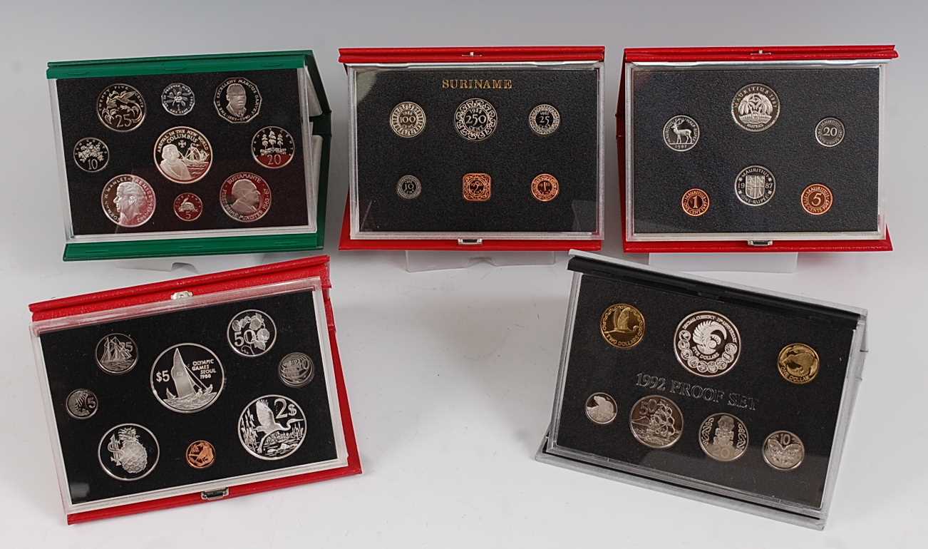 The Royal Mint, a collection of five proof sets to include 1987 Bank of Mauritius, 1988 Suriname,