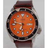 A gent's Seiko divers 200m steel cased automatic wristwatch, having orange dial with luminous dot