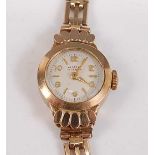 A 9ct yellow gold lady's fifteen-jewel manual wind wristwatch, with round quarter Arabic dial,