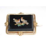 A late 19th century yellow metal micro-mosaic brooch, the brooch depicting two woodpeckers on a