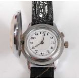 A stainless steel manual wind novelty wristwatch, having a hinged golf ball cover and a round