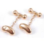 A pair of 15ct yellow gold double-ended cufflinks, each comprising a kidney bean and dumb-bell