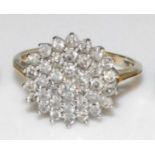 A 9ct yellow and white gold diamond circular cluster ring, featuring thirty-seven round brilliant