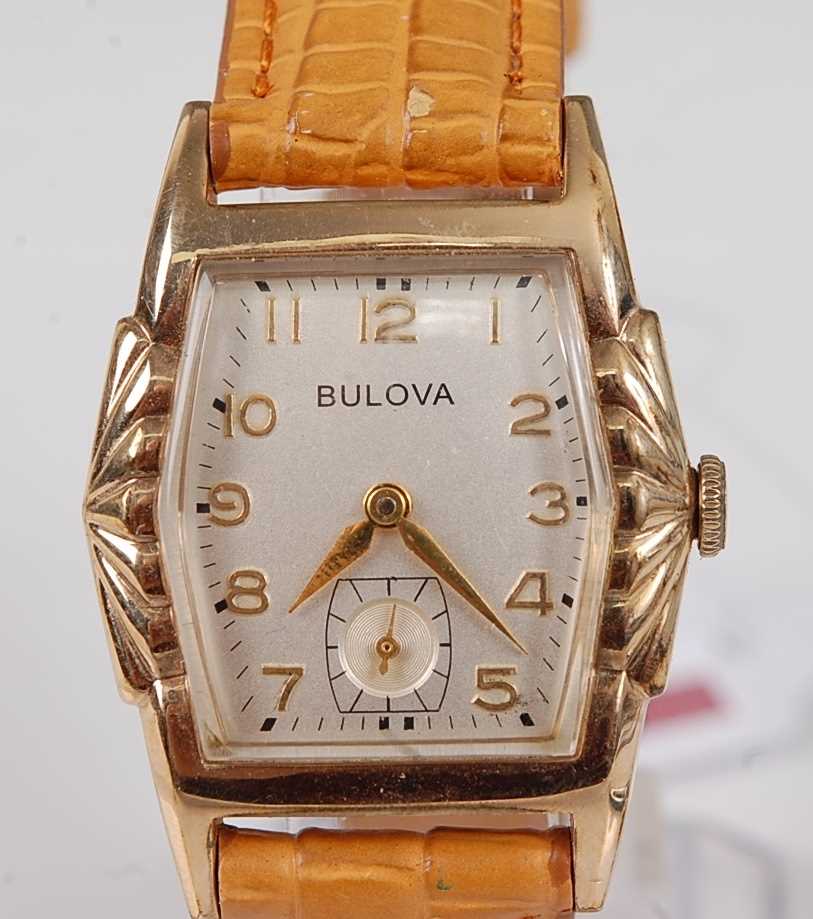 A Bulova gold plated gent's small size tank watch, having signed champagne dial with Arabic