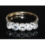 A yellow and white metal diamond five-stone half hoop eternity ring, featuring five graduated