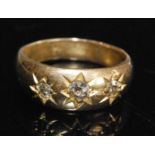 An 18ct yellow gold heavy diamond dress ring, having three graduated old European cut diamonds in